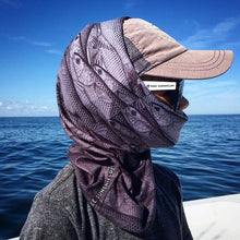 Youth on blue ocean wearing free sunshields hat sunglasses mullet run neck gaiter foulard